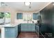 Well-lit kitchen with granite countertops, and stainless steel appliances at 8734 Meadowmont View Dr, Charlotte, NC 28269