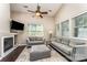 Bright living room featuring high ceilings, a fireplace, and modern furnishings at 8734 Meadowmont View Dr, Charlotte, NC 28269