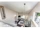 Spacious living room featuring a fireplace, modern furnishings, and natural light from large windows at 8734 Meadowmont View Dr, Charlotte, NC 28269
