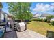 Outdoor patio and grill area with brick flooring and backyard at 8833 Cavonnier Ln, Charlotte, NC 28216
