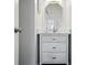 Clean bathroom with a vanity, marble countertop, and a well-lit mirror at 8833 Cavonnier Ln, Charlotte, NC 28216