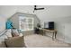 Finished room with comfortable seating, a desk, and a large window at 8833 Cavonnier Ln, Charlotte, NC 28216