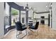 Dining area showcases a modern table setting and seamlessly connects to the kitchen at 8833 Cavonnier Ln, Charlotte, NC 28216
