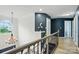 Hallway offering access to bedrooms featuring hardwood floors and an eye-catching chandelier at 8833 Cavonnier Ln, Charlotte, NC 28216