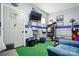 Fully equipped recreation room with work out bench, TV and comfortable seating at 8833 Cavonnier Ln, Charlotte, NC 28216