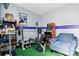 Recreation room featuring a workout bench, game console, and comfortable seating at 8833 Cavonnier Ln, Charlotte, NC 28216