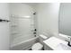 Clean, modern bathroom featuring a shower-tub combo, toilet, and vanity with a sleek mirror at Lot 1 New Pineola Rd, Charlotte, NC 28208