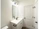 Bright bathroom featuring a single sink vanity, black hardware, and a large framed mirror at Lot 1 New Pineola Rd, Charlotte, NC 28208