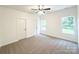 Spacious bedroom features soft carpet, two windows, and ample natural light at Lot 1 New Pineola Rd, Charlotte, NC 28208