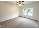 Bright bedroom with neutral carpet, ceiling fan, and natural light from two windows at Lot 1 New Pineola Rd, Charlotte, NC 28208