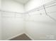 Walk-in closet includes shelving for organized storage in a well-lit and accessible space at Lot 1 New Pineola Rd, Charlotte, NC 28208