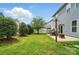 An outdoor setting with patio, seating, fire pit and verdant landscaping, ideal for entertaining at 1026 Slew O Gold Ln, Indian Trail, NC 28079