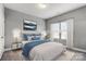 Staged bedroom with soft, neutral colors and lots of natural light at 1026 Slew O Gold Ln, Indian Trail, NC 28079