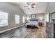 Spacious bedroom with vaulted ceiling, wood floors, and large windows providing ample natural light at 1026 Slew O Gold Ln, Indian Trail, NC 28079