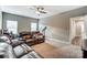 Cozy living room with leather furniture and neutral carpet at 1026 Slew O Gold Ln, Indian Trail, NC 28079