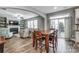 Open-concept living area flowing from the dining space to the living room with a fireplace at 1026 Slew O Gold Ln, Indian Trail, NC 28079