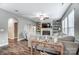 Spacious living room featuring a fireplace, floating shelves, a ceiling fan, and an open-concept design at 1026 Slew O Gold Ln, Indian Trail, NC 28079