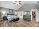 Spacious main bedroom with vaulted ceiling, wood floors, and ensuite bathroom and walk-in closet at 1026 Slew O Gold Ln, Indian Trail, NC 28079