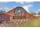 Community sign with artistic equestrian details and brickwork set in a landscaped area at 1026 Slew O Gold Ln, Indian Trail, NC 28079