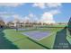 Well-maintained community tennis courts with a view of nearby residential buildings at 1026 Slew O Gold Ln, Indian Trail, NC 28079