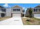Charming two-story home with stone accents, attached two-car garage and newly poured driveway at 1027 Hostler Ln, York, SC 29745