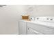 Functional laundry room with modern washer and dryer, complemented by a storage shelf and basket at 1027 Hostler Ln, York, SC 29745