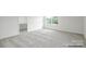 Spacious bedroom with natural light and modern carpet at 1031 Hostler Ln, York, SC 29745
