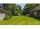 A spacious, well-kept backyard, with outbuildings and mature trees offers a serene outdoor retreat at 1040 Nc 90 W Hwy, Taylorsville, NC 20681