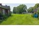 A spacious backyard with green grass and shade trees viewable from a house at 1040 Nc 90 W Hwy, Taylorsville, NC 20681