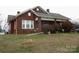 Charming brick home with a covered porch and a spacious front yard at 1040 Nc 90 W Hwy, Taylorsville, NC 20681