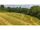 Recently mowed green field with some trees surrounding it at 1040 Nc 90 W Hwy, Taylorsville, NC 20681