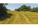 Land lot with cut grass and many trees in background at 1040 Nc 90 W Hwy, Taylorsville, NC 20681