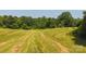 Wide shot of lot, partially cut grass, trees in the background at 1040 Nc 90 W Hwy, Taylorsville, NC 20681