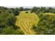 Aerial shot of a large lot showing partially cut grass and trees around its perimeter at 1040 Nc 90 W Hwy, Taylorsville, NC 20681