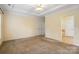 Bright bedroom featuring neutral carpet, ceiling fan, and trim at 1141 Ardwyck Pl, Rock Hill, SC 29730