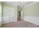 Inviting bedroom with neutral carpet, picture-frame molding, and doorway to hall at 1141 Ardwyck Pl, Rock Hill, SC 29730