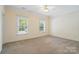 Bright bedroom with neutral carpet and natural light from the large windows at 1141 Ardwyck Pl, Rock Hill, SC 29730