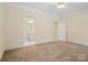 Bright bedroom features a ceiling fan and adjacent bathroom and closet at 1141 Ardwyck Pl, Rock Hill, SC 29730