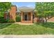 Charming brick home with a well-manicured lawn and inviting front porch at 1141 Ardwyck Pl, Rock Hill, SC 29730