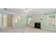 Cozy living room with a fireplace, neutral carpet, and natural light at 1141 Ardwyck Pl, Rock Hill, SC 29730