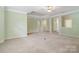 Open living space with columns, a ceiling fan, and neutral carpet at 1141 Ardwyck Pl, Rock Hill, SC 29730