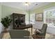 Office features a large desk, a patterned rug, and natural light from the windows at 1141 Ardwyck Pl, Rock Hill, SC 29730