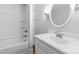 Bright bathroom featuring a shower/tub combo and a modern vanity with chrome fixtures at 115 W 5Th Ave, Gastonia, NC 28052