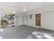 Covered outdoor patio featuring a wood deck floor and white shiplap walls at 115 W 5Th Ave, Gastonia, NC 28052