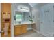 Bright bathroom featuring a modern vanity, tiled floor, and convenient layout at 136 Elba Dr, Mooresville, NC 28115