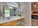Bright bathroom featuring a modern vanity, tiled floor, and convenient layout with bedroom view at 136 Elba Dr, Mooresville, NC 28115