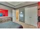 Cozy bedroom with gray walls, closet, and an en-suite bathroom at 136 Elba Dr, Mooresville, NC 28115