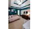 Charming bedroom with a tray ceiling, accent wall, floral wallpaper, and neutral carpeting at 136 Elba Dr, Mooresville, NC 28115