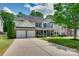 Charming two-story home with a two-car garage and well-manicured lawn in a desirable neighborhood at 136 Elba Dr, Mooresville, NC 28115