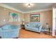 Cozy living room with comfortable seating, hardwood floors, and bright natural light, perfect for relaxation at 136 Elba Dr, Mooresville, NC 28115